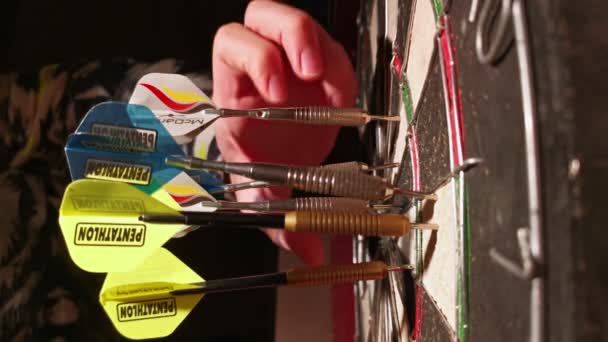 Person Pulling Multiple Darts Rubber Dartboard Static Head Shot — стоковое видео
