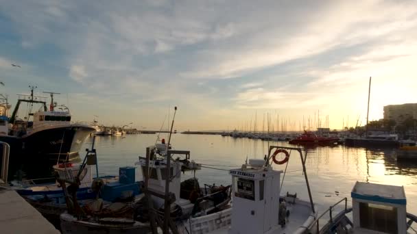 Slow Motion Pan Fishing Boats Parked Harbor Sunset — Vídeo de Stock