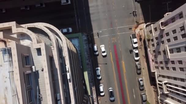 Overhead Aerial Tracking Shot Looking Downtown City Rooftops Tall Office — Vídeos de Stock