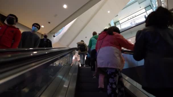 Riding Escalator Toronto Easton Centre Random Masked People Social Distancing — Stockvideo