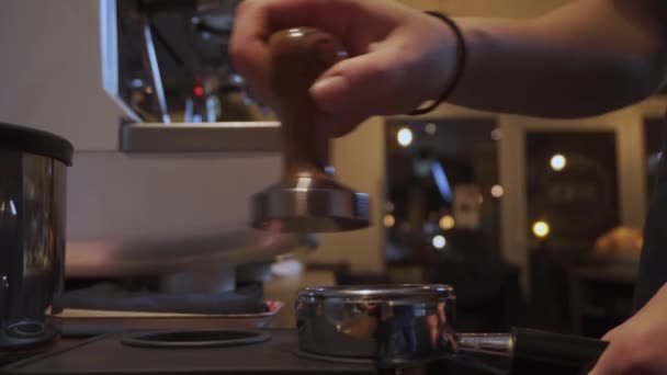 Barista Tamping Coffee Grinds Small Dimly Lit Cafe Bar Static — Stockvideo