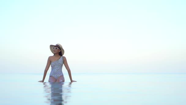 Young Fit Woman Bathing Suit Sunglasses Sun Hat Sits Invisible — Video Stock