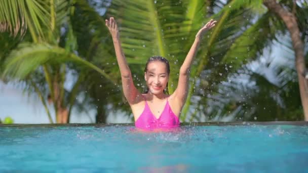 Woman Splashes Pool Water Air — стоковое видео