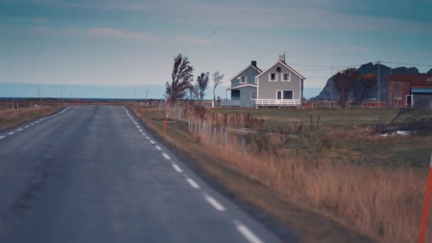 Narrow Rural Road Goes Windswept Northern Landscape Houses Barns Stand — ストック動画