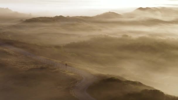 Person Going Morning Walk Countryside Road Foggy Mountains Hills Aerial — стоковое видео