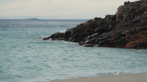 Waves Crashing Rocks Spilling Sandy Beach Slow Motion Close Shot — Stockvideo