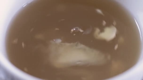 Macro Close Swirling Ginger Lemon Pieces Honey Hot Drink Close — Video Stock