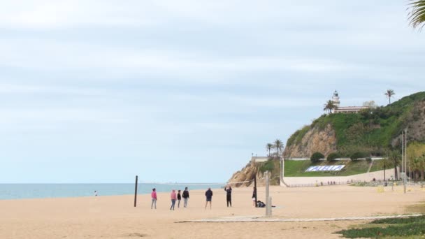 Group Friends Playing Beach Volleyball Calella Cloudy Day — стокове відео