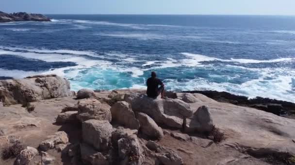 Person Man Alone Rock Meditates Reflects His Depression — Vídeo de Stock