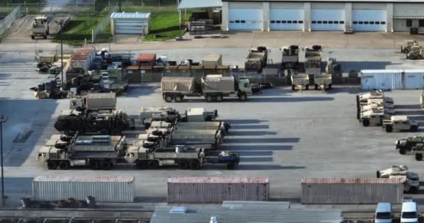 Aerial View Military Vehicles Gear Parked Base Tracking Drone Shot — Stockvideo