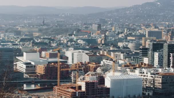 Barcode area in downtown Oslo, main capital of Norway. Large office buildings and construction cranes. Holmenkollen in the background.4K straight pan.