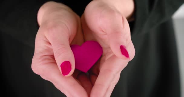 Woman Opens Her Palms Shows Pink Heart Shape Close — Stock Video