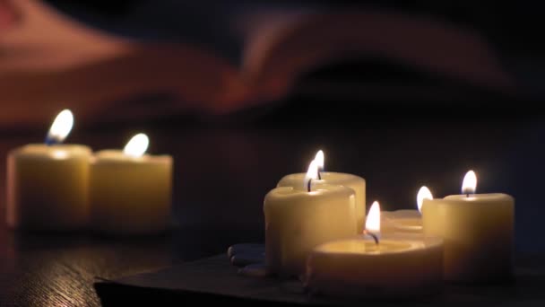 Pages Book Flip Man Hand While Lit Candles — ストック動画