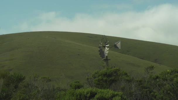 Windmill Front Pastoral California Hills Wide Shot — ストック動画