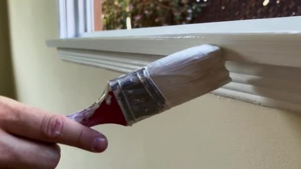 Male Hand Painting Trim Window White Paint Close Paint Brush — Stock Video