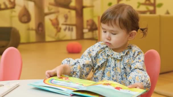 Cute Little Girl Browsing Book Gyeonggi Children Museum South Korea — Stockvideo