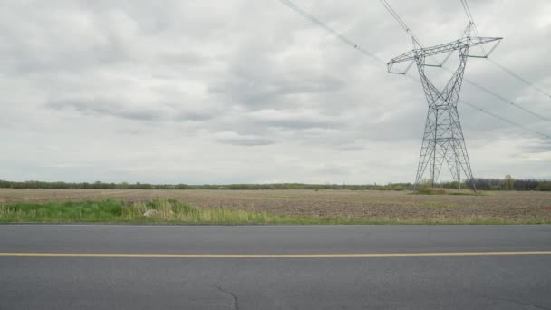 Quiet Road Remote Place Red Car Passes Frame Static Shot — Video