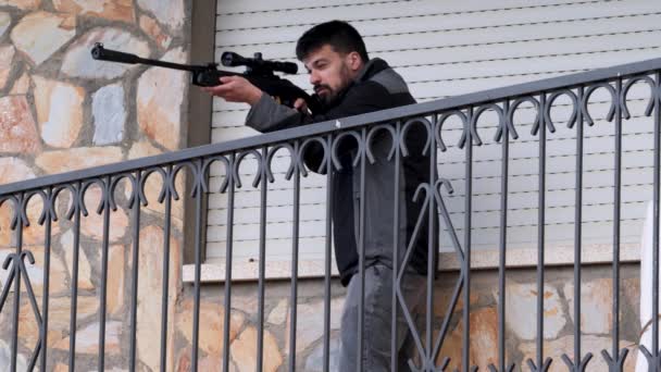 Young Man Protects His Home Sniper Rifle Aiming Looking Intruders — Vídeo de Stock