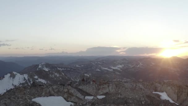 Drone Clip People Standing Tip Alpine Mountain Winter Sunset Background — Stockvideo