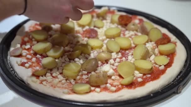 Chef Putting Pepperoni Slices Pizza Sauce Cheese Potatoes Close — Vídeo de stock