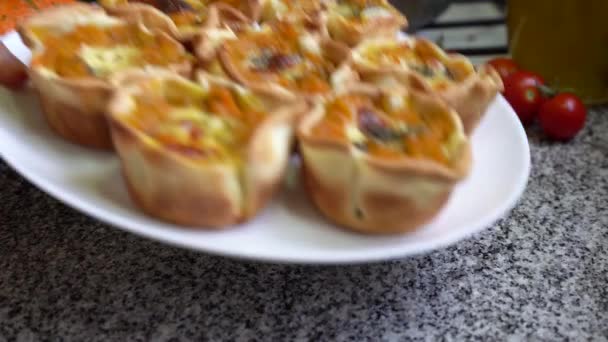 Hand Placing Plate Freshly Cooked Pumpkin Tarts Table Close — Stock Video