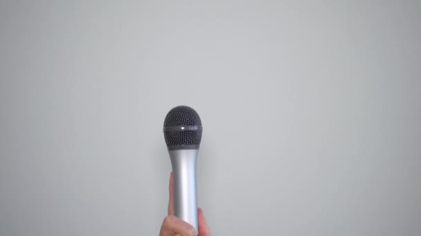 Hand Holding Gray Microphone Concept Having Voice Being Heard — Stock Video