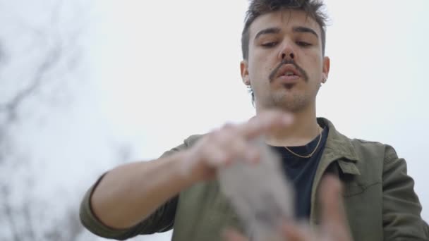 Low Angle Shot Magician Juggling Cards Hand Trying Impress Public — Stock Video