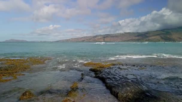 Low Angle Aerial View Passing Rocks Waves Pacific Ocean — Video