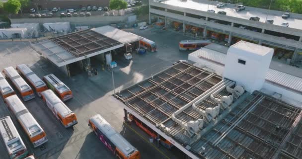 Aerial Drone Shot Metro Buses Arriving Leaving Station Parking Lot — Stock Video