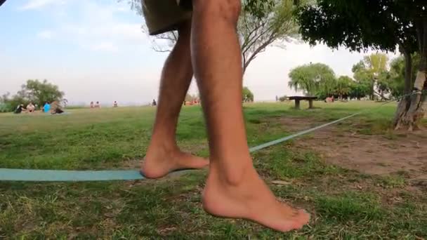 Close Legs Balancing Slack Line Park Outdoors Trees Frames Second — Stock Video