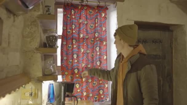 Young Man Opening Window Cave Home Grabbing Glass Fresh Tea — Videoclip de stoc