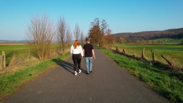 Aerial View Couple Holding Hands Walking Rural Road Sunny Germany — Stockvideo