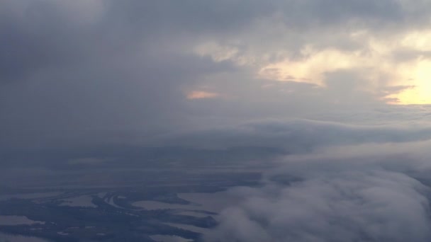 Looking Out Airplane Window Golden Sunrise While Descending Dense Clouds — Video Stock