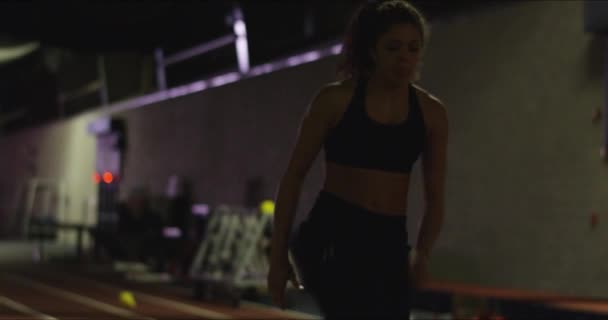 Cinematic Medium Shot Female Athlete Warming High Knees Training Field — Stockvideo