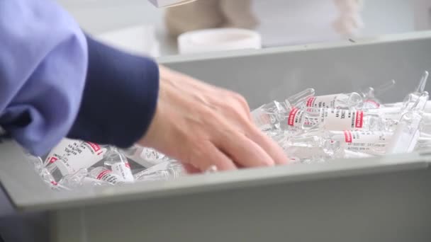 Glass Medicinal Vials Being Packed Hospital Staff Close Grabbing Vials — Stockvideo