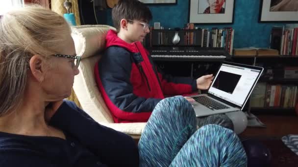 Closeup Mature Mother Teen Son Watching Video Laptop Living Room — Video Stock