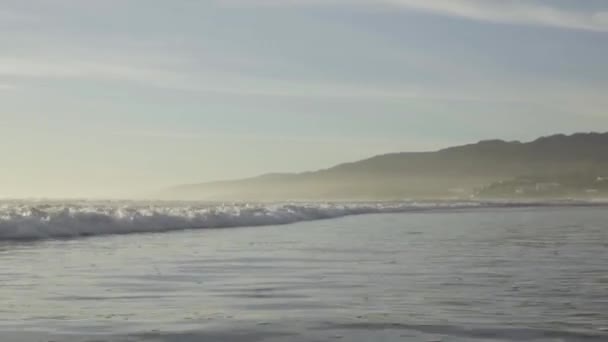 Small Gentle Waves Pass While Mountains Stand Tall Distance — Stockvideo