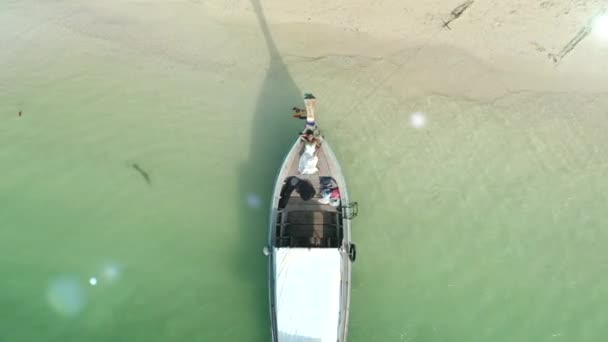Drone Shot Elevating Girl Beach Dress Longtail Boat Reveal White — Vídeo de Stock