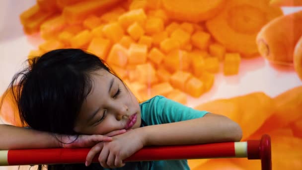 Young Girl Sitting Shopping Cart Store Alone Napping Arms Food — Stock videók