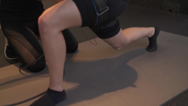 Young Female Works Hard Perfecting Lunges Help Her Trainer Ems — Stockvideo