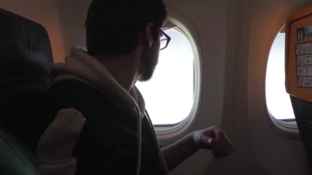 Slow Motion Footage Young Man Looking Out Airplane Window Close — Vídeo de Stock