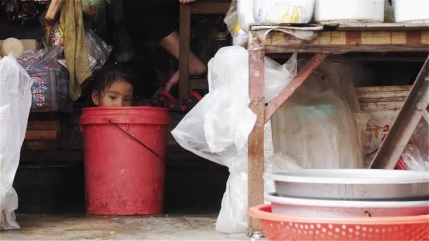 Child Sitting Bucket Watches People Walk Saigon Vietnam — Video