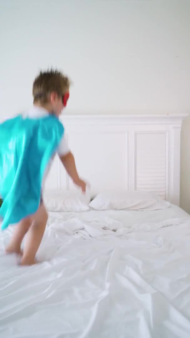 Superhero Boy Jumping Bed — Stok video