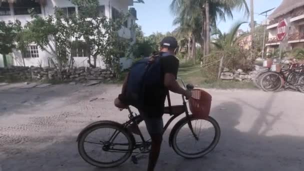 Hispanic Male Riding Bicycle Beach Town Mexico — Stockvideo