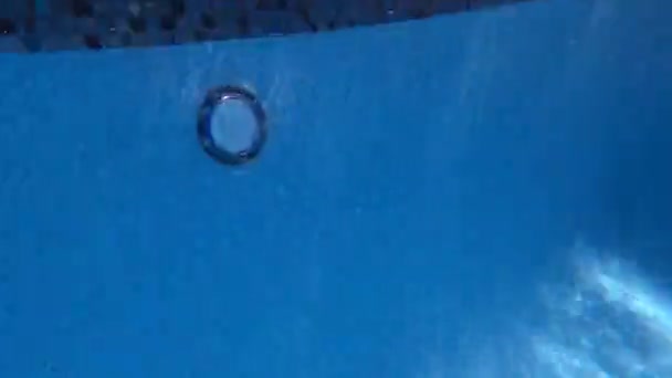 Young Boy Spins While Jumping Pool Water Gun Fast Paced — Stok video