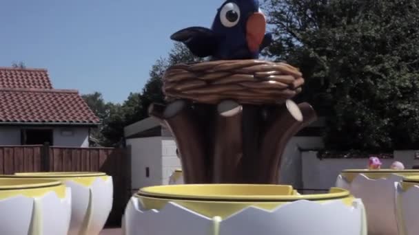 Children Enjoying Ride Teacups Fair Ground Amusement Park While Holiday — Vídeo de stock