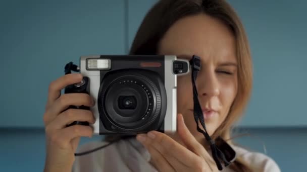 Young Female Photographer Using Instant Photo Camera Make Film Picture — ストック動画