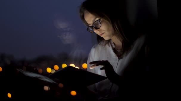 Woman Sitting Window Night Time She Using Laptop Mobile Phone — Stockvideo