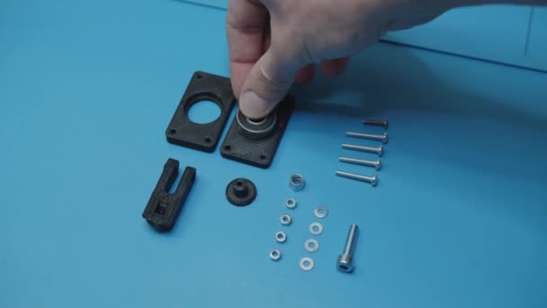 Small Parts Assembly Top View Blue Background — Stok video