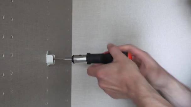 Man Installing Clothes Rail Wardrobe Using Screwdriver Close — Video Stock